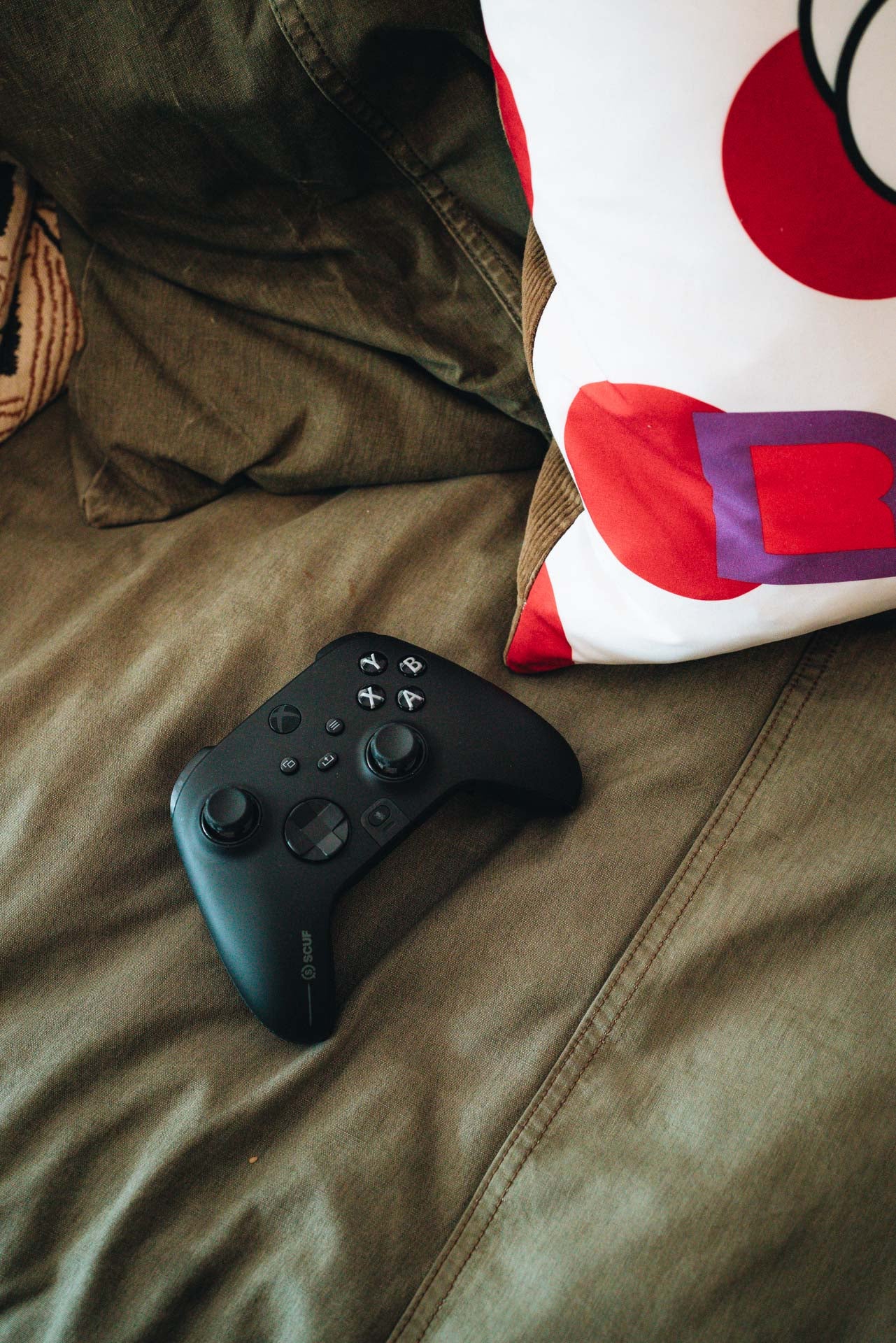 Xbox Controller Lying on Couch Not on a Milhouse Concrete Controller Stand 